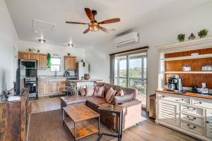 a living room with a couch and a ceiling fan at Prescott Home Close to Hiking and Medical Centers! in Granite Dells