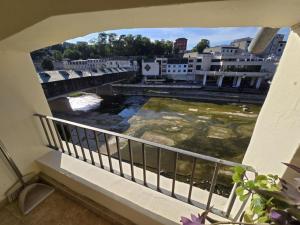 a view of a river from a balcony at Апартамент Венеция in Lovech