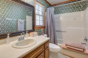 a bathroom with a sink and a toilet and a shower at Playground and Grill Pet-Friendly Griffin Getaway! in Griffin +20 photos