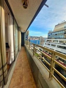 a balcony with a view of a cruise ship at Viña Sunset Escape in Viña del Mar