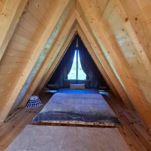 a room with two beds in a attic at Korijeni in Šavnik