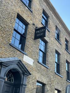a brick building with a street sign on it at Smiths Townhouse in Broadstairs
