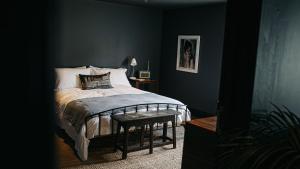 a bedroom with a bed and a table with a lamp at Smiths Townhouse in Broadstairs