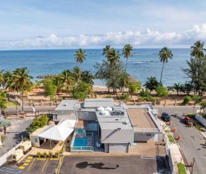 an aerial view of a house and the ocean at AQUA Terrazas 6&7 3BR Fun & Dining by the Beach in Mameyal
