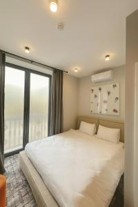 Postel nebo postele na pokoji v ubytování Unit Hotel