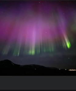 an image of the northern lights in the sky at Hótel Eyjafjallajökull in Hvolsvöllur