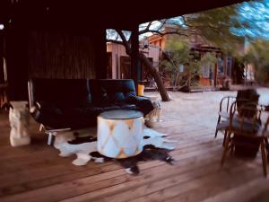 a living room with a couch and a drum at Reserve The Entire Ranch up to 28 guests in Desert Hot Springs