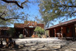an old building with trees in front of it at Reserve The Entire Ranch up to 28 guests in Desert Hot Springs +40 photos