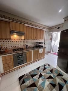 Η κουζίνα ή μικρή κουζίνα στο élégant Studio Résidence calme à El Menzah 7 bis