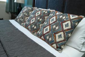 a bed with two pillows on top of it at Costa Bonita Private Villas in Culebra