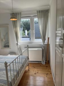 Postel nebo postele na pokoji v ubytování Dat smugge Hus in Maasholm-Bad