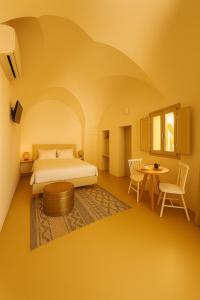 a rendering of a bedroom with a bed and a table at Palazzo Boccaccio in Matino