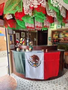 a counter with a mexican flag on it at Posada Arny in Tepotzotlán