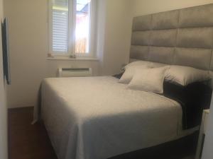 Postel nebo postele na pokoji v ubytování Touched VIP Zadar