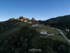 an aerial view of a house on a hill at Cabana c/ vista e jacuzzi Serra Catarinense VST025 in São Paulo dos Pinhais