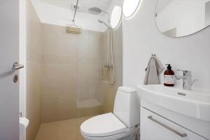a bathroom with a shower and a toilet and a sink at N337-Karrebaeksminde-Strandrylevej-11 in Enø By