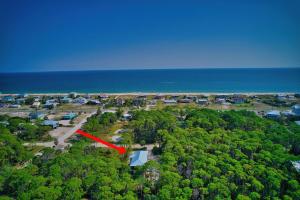 an aerial view of a house with a red arrow at Endless Summer St George 4Bed 3 5 Bath with POOL in St. George Island +127 photos