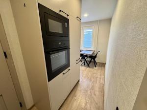 Kuchyň nebo kuchyňský kout v ubytování Cozy Baltic Apartment + 3 fotografie