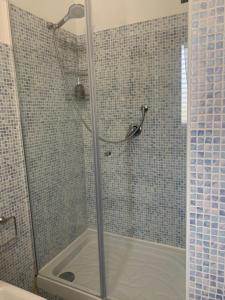 a shower with a glass door in a bathroom at La Terrazza in San Giovanni Valdarno +33 photos