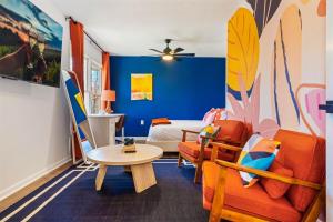 a room with a bed and a table and chairs at Pet Friendly, Mini Golf, Game Room, Hot Tub in McGaheysville