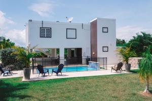 a villa with a swimming pool and a house at Private Pool Home Beach 15 min Drive in Cabo Rojo