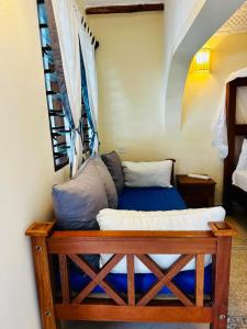 a room with a bed in a room at Jean pierre studio apartment in Malindi