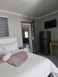 Postel nebo postele na pokoji v ubytování The Residence