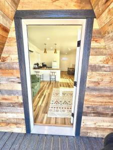 a view of the living room and dining room from the front door at Glacier Alpine Escape in East Glacier Park +3 photos