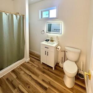a bathroom with a toilet and a sink and a shower at Glacier Alpine Escape in East Glacier Park