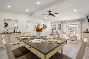 a kitchen and dining room with a table and chairs at The Pine House in Davidson