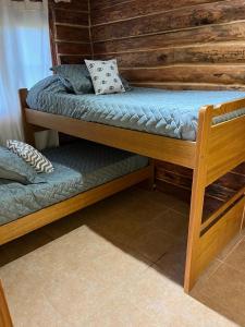 Postel nebo postele na pokoji v ubytování Altandes Cabañas