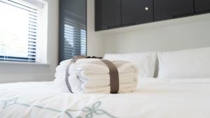 a backpack sitting on top of a bed at 1 bedroom guesthouse including parking on premises in Braintree