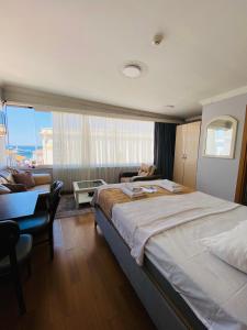 Ένα ή περισσότερα κρεβάτια σε δωμάτιο στο Kalamari pansiyon 2