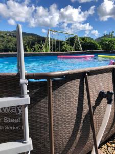 a view of a swimming pool with a trampoline at PASSION de PARADIS in Rivière-Pilote