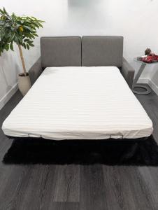 a bed in a room with a white mattress at Casa Valencia in Tucson