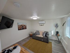 a living room with a couch and a rug at Casa Valencia in Tucson