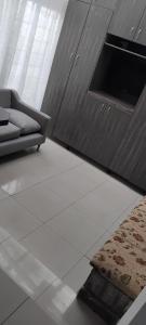 a living room with a couch and a rug at Solomon's Nest in Glencairn