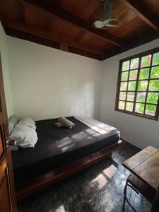 Postel nebo postele na pokoji v ubytování Woodstock Hostel
