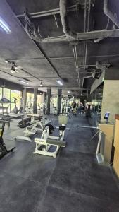 a gym with a lot of exercise equipment in it at Tuk Tulum Estudio con Balcon 005 in Tulum