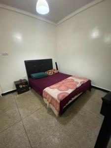 Ένα ή περισσότερα κρεβάτια σε δωμάτιο στο Atlas Agdal Apartment