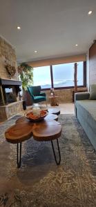 a living room with a couch and a table at Mont Rock in Synikia Mesi Trikalon +7 photos