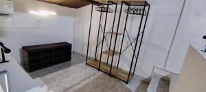 a living room with a fireplace and a staircase at Raggiu di Suli in Noto