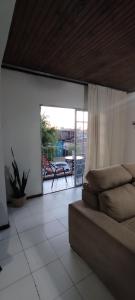 a living room with a couch and a balcony at Rivera, céntrico , moderno y luminoso ,con 2 dormitorios in Rivera +18 photos