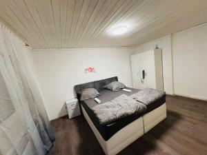 a bedroom with a large bed in a room at Ferienhaus Adler in Unterlüß