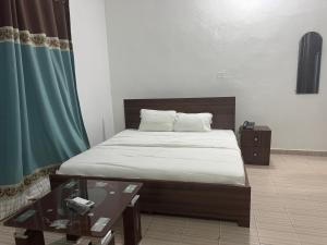 Ένα ή περισσότερα κρεβάτια σε δωμάτιο στο Golden Lily Hotels