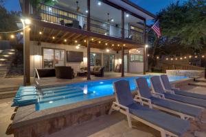 a house with a swimming pool at night at Lake Travis House with Private Dock, Pool and Hot Tub! in Leander