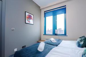 a bedroom with a bed and a window at 1 BR Flat By Eason Stays Short Lets & Serviced Accommodation Wigan With Free parking! in Wigan