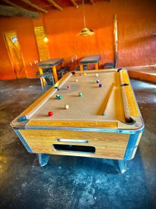 a pool table with balls on top of it at Koonex in Los Reartes