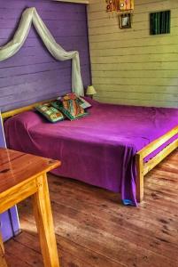 Ένα ή περισσότερα κρεβάτια σε δωμάτιο στο Cabaña Kala - Encanto Tigre