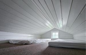 a large white room with a bed in it at Gorgeous Home In Eggedal With Sauna in Surteberg